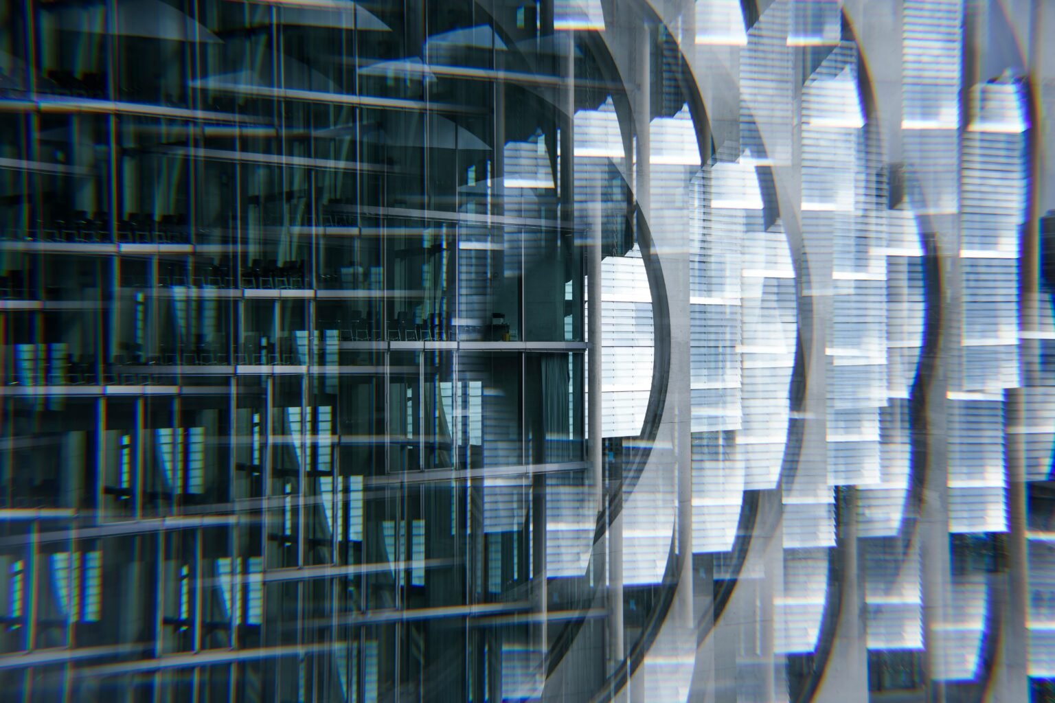 Abstract view of a modern skyscraper with glass reflections creating a futuristic urban look.