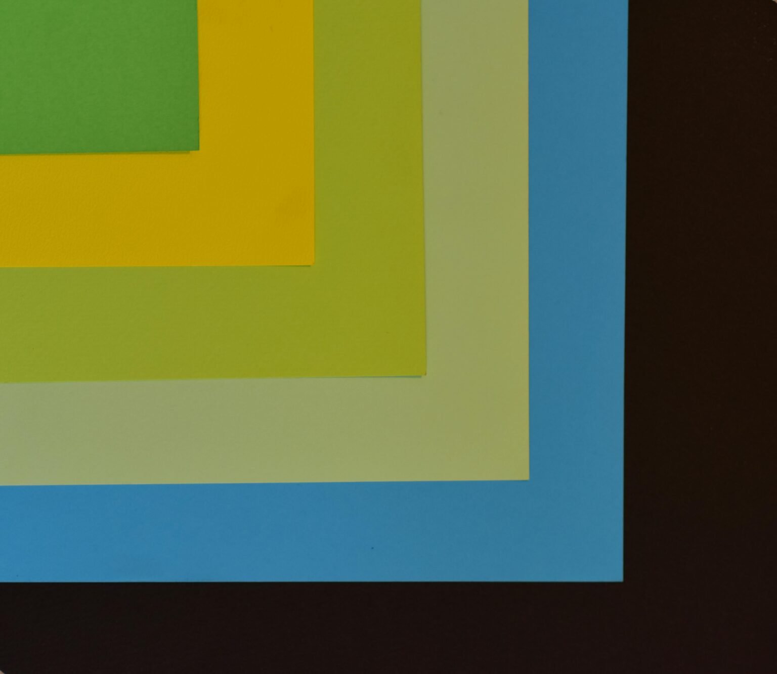 مقارنة بين النموذج الاتصالي في ديزني وApple وNetflix Abstract composition with colorful layered paper creating a geometric pattern.